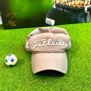 Titliest “Pro-V1” Golf Hat. Titliest embroidered on front and back. Buckle strap